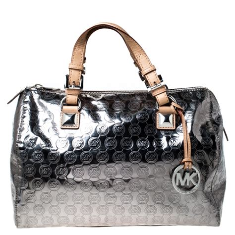 michael kors silver metallic handbags.